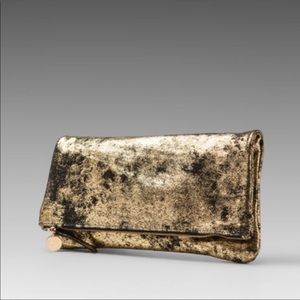 Clare Vivier Clare V's Signature foldover clutch in black and gold